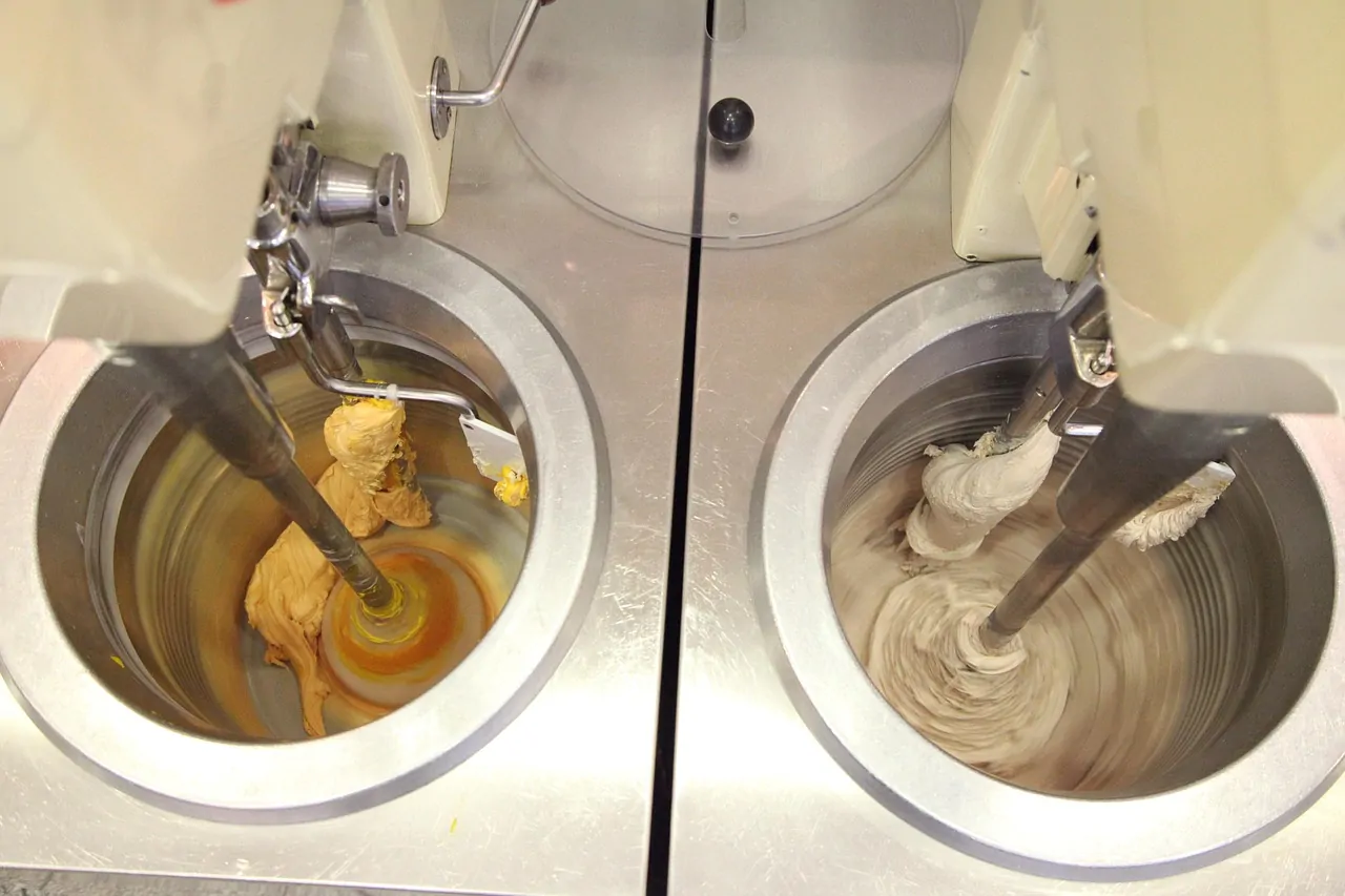 Open bowl ice cream machine cylinders with mix being frozen